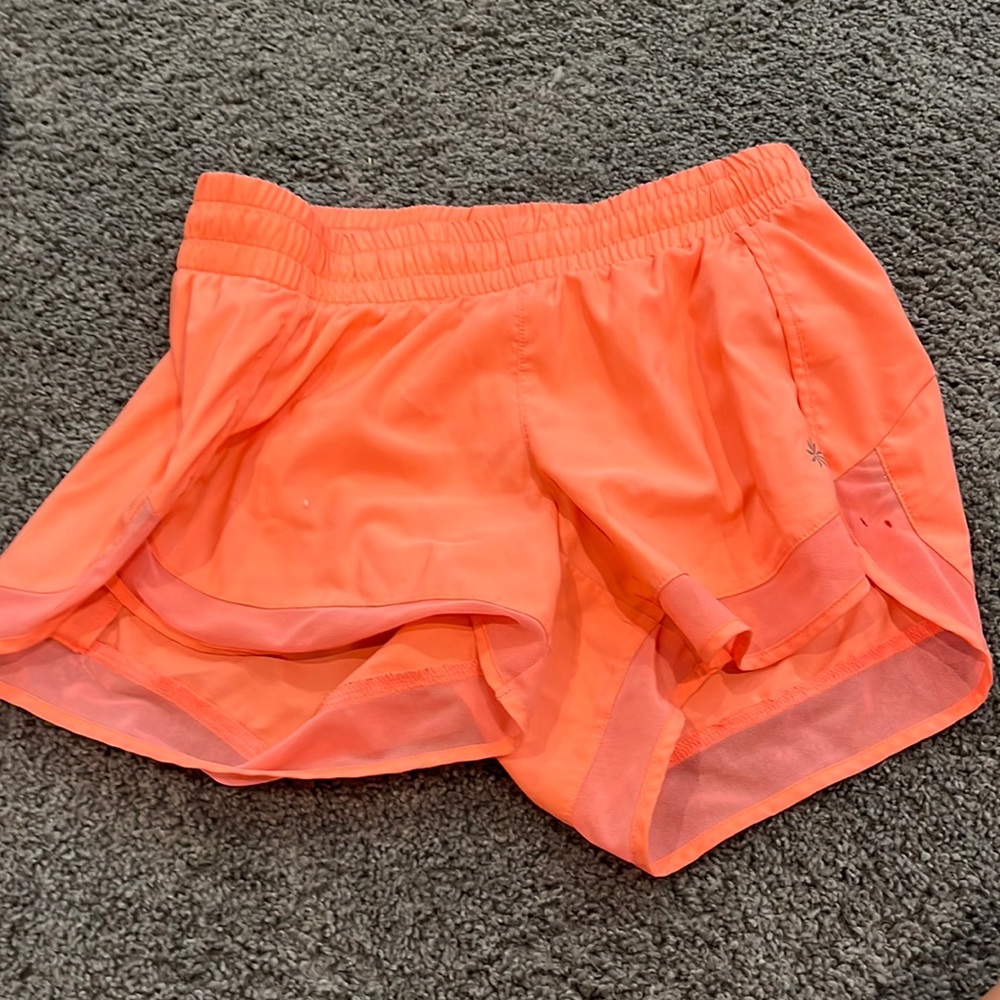 neon pink/orange 4 inch athleta shorts they are more pink than orange
